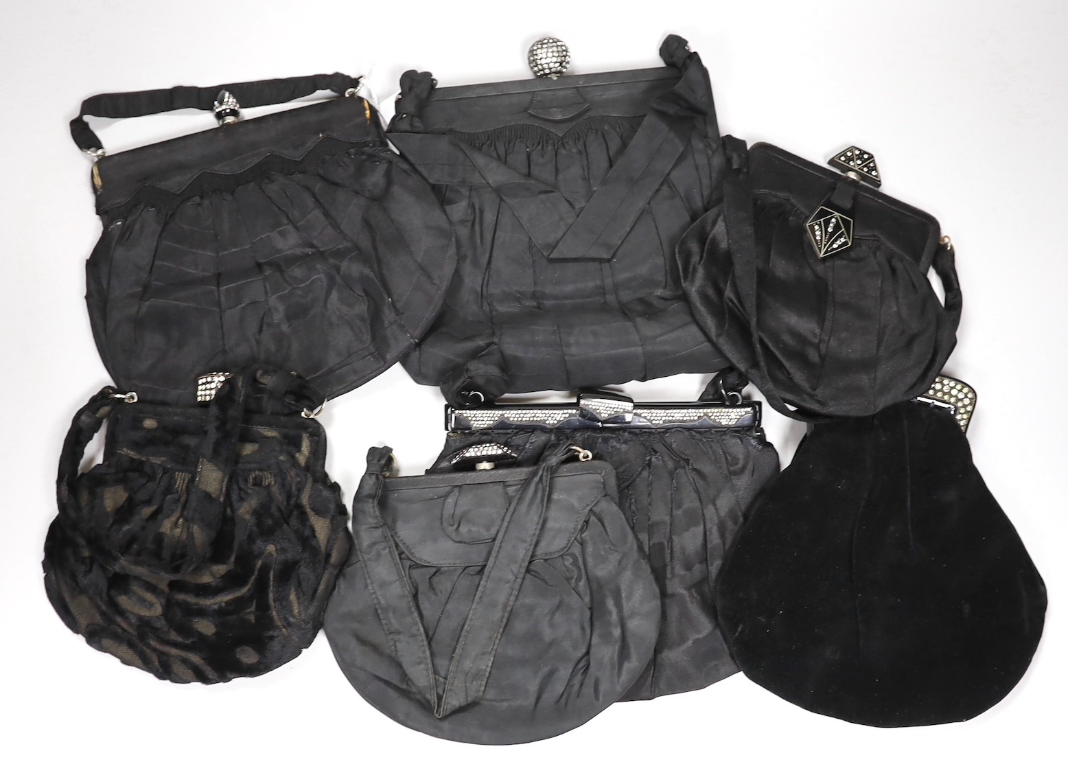 A 1930’s evening bag with silver frame, seven 1930’s-40’s evening bags with diamante encrusted Bakelite frames and clasps, a costume jewelled bag and two gilt and sequin bags